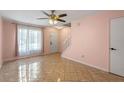 Spacious living room with neutral paint, ceiling fan and lots of natural light at 130 Kristi Ann Ct, Winter Springs, FL 32708