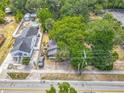 Aerial view of the home showcasing its fenced yard and mature trees at 1314 S Mellonville Ave, Sanford, FL 32771