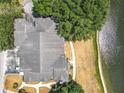 An aerial view of condo complex with scenic lakeside views and mature trees at 163 Villa Di Este Ter # 105, Lake Mary, FL 32746
