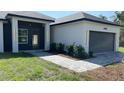 Charming single-story home boasts modern architecture, neat landscaping, and a welcoming entrance at 17380 Sw 36Th Ave Rd, Ocala, FL 34473