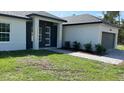 Charming single-story home boasts modern architecture, neat landscaping, and a welcoming entrance at 17380 Sw 36Th Ave Rd, Ocala, FL 34473