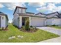 Beautiful home with a well-maintained lawn and paver driveway, showcasing great curb appeal at 1904 Archer Dr, Minneola, FL 34715