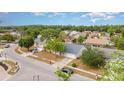 A residential street showcasing single-Gathering homes with well-kept lawns and mature trees, creating a peaceful neighborhood setting at 1993 Excalibur Dr, Orlando, FL 32822