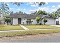 Well-kept single Gathering home with mature trees and manicured lawn at 2028 Sussex Rd, Winter Park, FL 32792