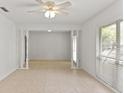 Bright living room with large windows and tile flooring throughout at 2028 Sussex Rd, Winter Park, FL 32792