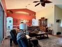 Cozy living room featuring ample seating, natural light, and tasteful decor at 24125 Peekskill St, Leesburg, FL 34748