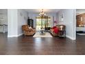 Bright living room with cozy furniture, tile floors and view of backyard at 2739 Village Pine Ter, Orlando, FL 32833