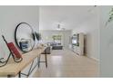 Bright living room featuring tile floors, a ceiling fan, and large windows for lots of natural light at 4544 Point Look Out Rd, Orlando, FL 32808