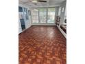Enclosed sunroom with many windows and a door to the outside at 551 Pine Needle Ct, Lake Mary, FL 32746