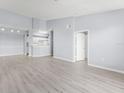Spacious living room features sleek flooring, recessed lighting, and an open layout leading to the kitchen at 5530 Metrowest Blvd # 309, Orlando, FL 32811