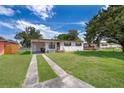 A single-story home with driveway and a classic exterior at 5601 Andora St, Orlando, FL 32807