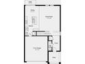 Layout of the house, featuring the garage, kitchen, dining, living room, and half bath at 5657 Loggia Ln, Kissimmee, FL 34758