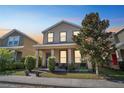 Attractive home showcasing a welcoming porch and manicured shrubs, offering a cozy curb appeal at 6822 Habitat Dr, Harmony, FL 34773