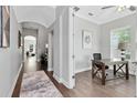 Bright home office with hardwood floors, large windows and a view to the front of the home at 8263 Bellow St, Orlando, FL 32827