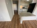 Galley-style kitchen with white cabinets and granite breakfast bar at 122 Water Front Way # 360, Altamonte Springs, FL 32701