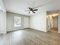 Open living room with neutral paint, modern floors and ample natural light at 130 Aragon Ave, Umatilla, FL 32784