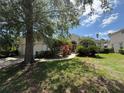 Lush landscaping frames this well-maintained home with a welcoming entrance at 13250 Meergate Cir, Orlando, FL 32837