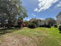 Attractive home featuring a manicured lawn and mature trees at 13250 Meergate Cir, Orlando, FL 32837