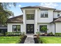 Beautiful two-story home with manicured lawn and inviting entrance, exuding curb appeal at 1840 Bryan Ave, Winter Park, FL 32789
