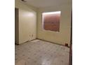 Empty bedroom features boarded window and needs renovations at 2115 Messina Ave, Orlando, FL 32811