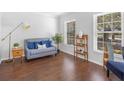 Bright living room with hardwood floors, stylish decor, and plenty of natural light from the windows at 226 Ringwood Dr, Winter Springs, FL 32708