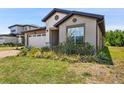 Attractive single-story home boasting a brick driveway, a two-car garage, and mature landscaping at 3128 Oxbow Ct, Harmony, FL 34773