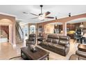 Spacious living room boasts an open floor plan, tile floors, and comfortable seating, seamlessly connected to other living spaces at 613 Crownclover Ave, Orlando, FL 32828
