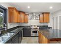 Gourmet kitchen with custom cabinetry, stainless steel appliances, and granite countertops at 613 Lake Ave, Altamonte Springs, FL 32701