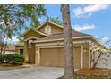 Charming home featuring manicured landscaping, a two-car garage at 709 Strihal Loop, Oakland, FL 34787