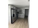 Modern kitchen features gray cabinets, stainless steel appliances, and stylish backsplash at 73 Brooks Dr, Ormond Beach, FL 32176