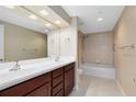Bathroom features a double sink vanity and a shower over tub at 918 Lotus Vista Dr # 102, Altamonte Springs, FL 32714