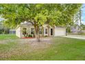 Charming single-story home with a well-manicured lawn and attached two-car garage at 927 Cambridge Ct, Kissimmee, FL 34758