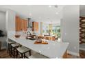 Bright kitchen with white quartz countertops, stylish cabinetry and stainless steel appliances at 9560 Archway Aly, Orlando, FL 32832