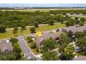 Aerial view of a neighborhood near an airport showcasing community layout and green spaces at 10128 Hartford Maroon Rd, Orlando, FL 32827
