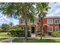 Charming two-story home with a covered entry and mature landscaping at 10128 Hartford Maroon Rd, Orlando, FL 32827