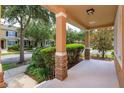 Inviting front porch with stone accents and manicured landscaping at 10128 Hartford Maroon Rd, Orlando, FL 32827