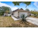 Well-maintained single-Gathering home with lush landscaping and a cozy front porch at 11113 Sylvan Pond Cir, Orlando, FL 32825