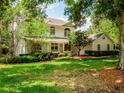 Beautiful two-story home with manicured lawn and lush landscaping at 11335 Winston Willow Ct, Windermere, FL 34786
