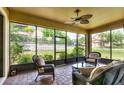 Relaxing screened patio with comfortable seating and views of the backyard at 1300 Island Green St, Davenport, FL 33896
