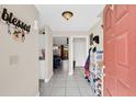 Bright foyer with tile flooring, neutral walls, and a welcoming atmosphere at 1612 Sandy Point Sq # 56, Orlando, FL 32807