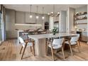 Bright kitchen featuring a marble breakfast bar, stainless steel appliances, and a dining area at 2422 Musselwhite Ave, Orlando, FL 32804
