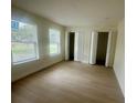 Bright bedroom featuring fresh paint, modern floors, and two large closets at 2514 Highlawn Ave, Sanford, FL 32773
