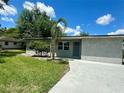 Charming single story home boasts lush green lawn, freshly painted exterior, and newly laid concrete driveway at 2514 Highlawn Ave, Sanford, FL 32773