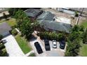 An aerial view of the property, showcasing the house and surrounding area with parked cars at 300 Broadview Ave, Altamonte Springs, FL 32701