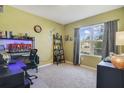 Bright bedroom features neutral walls, carpeted floors, and a large window at 415 Anne St, Deland, FL 32724