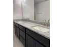 Bathroom features double sinks, granite countertops, and sleek modern fixtures at 4224 Sagefield Dr, Harmony, FL 34773