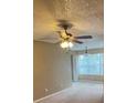 Living room with carpet and neutral walls; large window with natural light at 5164 Conroy Rd # 1526, Orlando, FL 32811