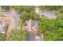 Beautiful aerial view of home with screened pool, lush greenery, and mature trees on a quiet street at 1100 Oday Dr, Winter Springs, FL 32708