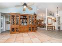 Inviting open living space featuring tile floors and a large wooden cabinet at 1100 Oday Dr, Winter Springs, FL 32708