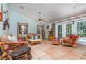 Relaxing living room with tile floors, comfortable furniture, and access to a screened patio at 1100 Oday Dr, Winter Springs, FL 32708